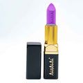 Alhalal Cosmetics lila Samtlippenstëft mat gëllener Hülle a schwaarzem Kapp. PARSE LIPSTICK